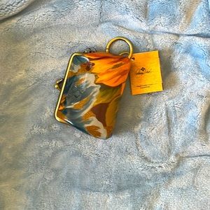 Patricia Nash leather coin purse with snap closure.  Multi-colored floral.
